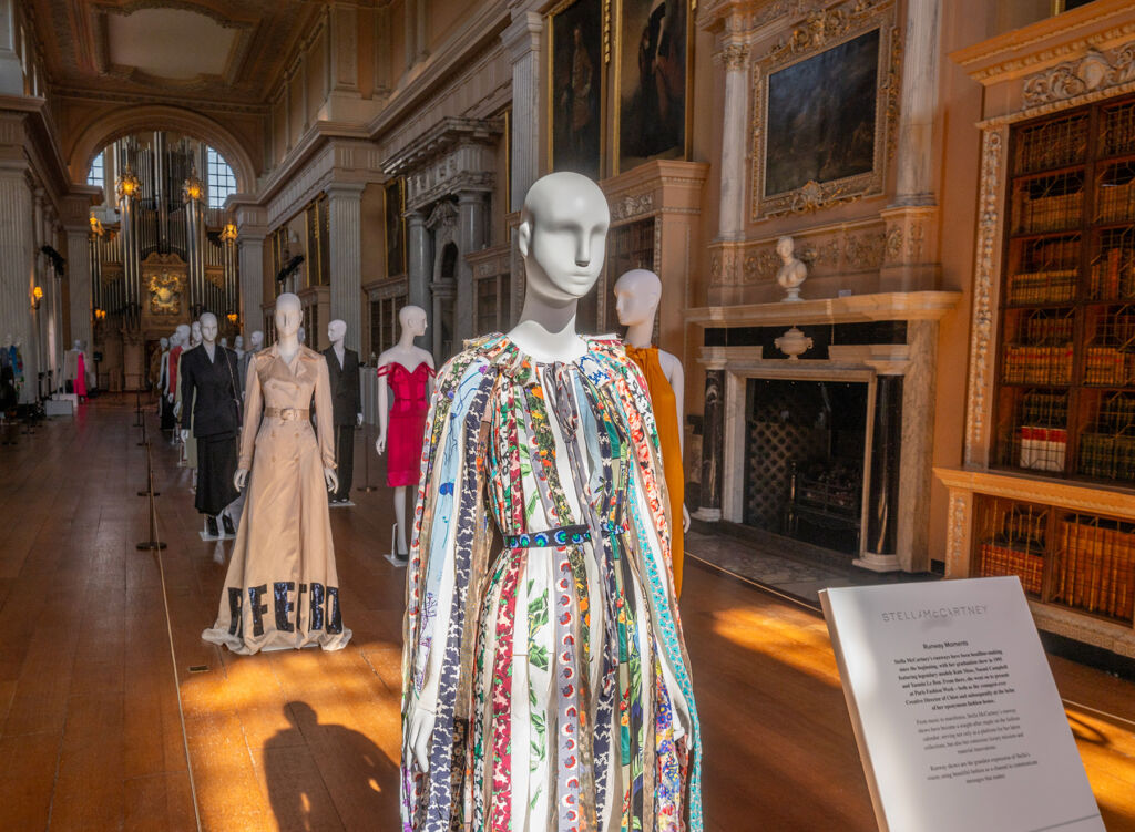 A parade of mannequins adorned with iconic fashion pieces