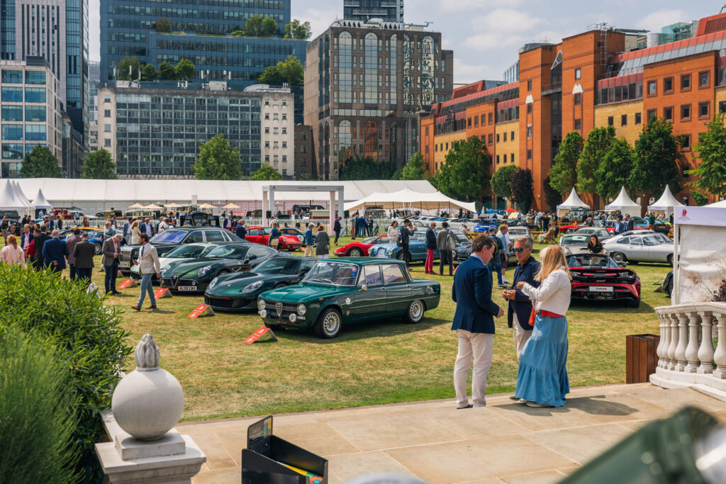 Guests admiring the historic cars on display