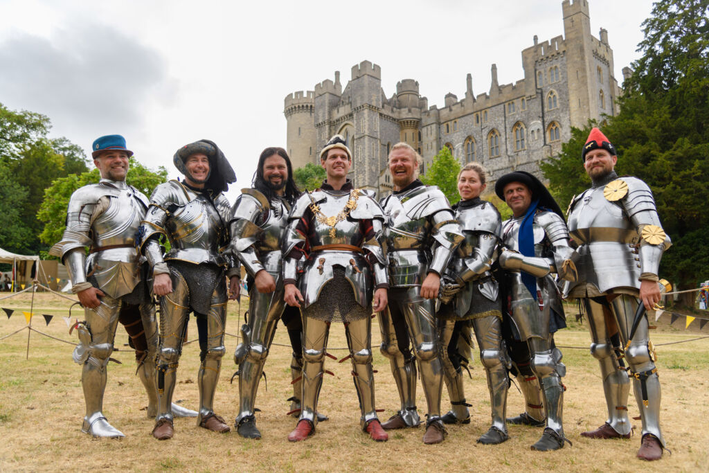 Knights in armour standing in front of the castle