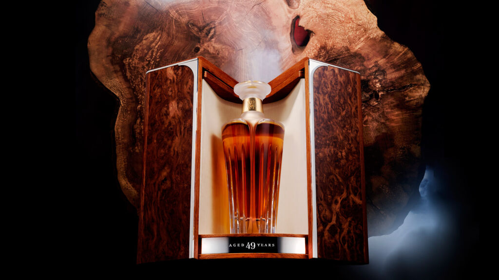 A bottle of Chapter Five in its open case revealing the beauty of the Waterford Crystal decanter