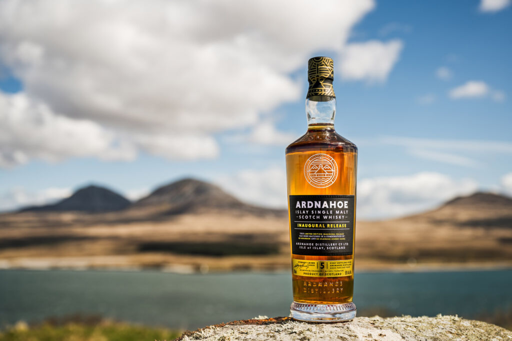 The Luxurious Magazine Whisky Industry News Round-up for June 2024 11 A bottle of Ardnahoe Inaugural Release placed on the shore of a loch