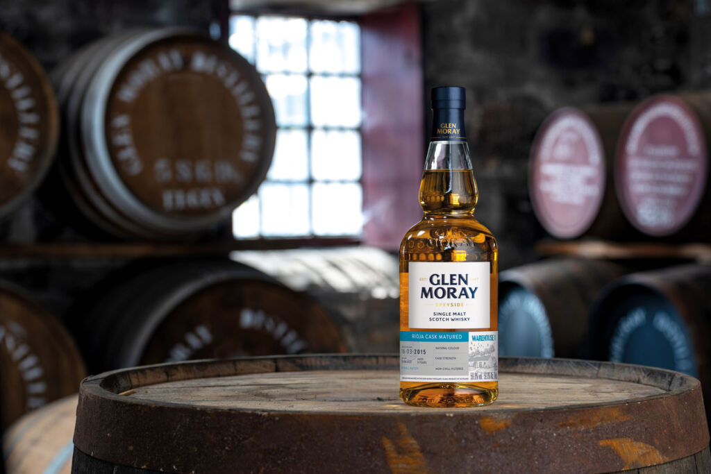 The Luxurious Magazine Whisky Industry News Round-up for July 2024 20 A bottle of the Glen Moray placed on top of a barrel in the distillery cellar