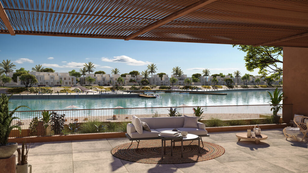 From Fragmentation to Flourishing, The New Architecture of Belonging 9 A view of modern properties from across a river