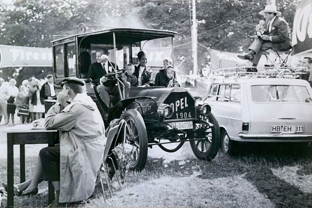 A black and white photograph showing the car being driven in its hey day
