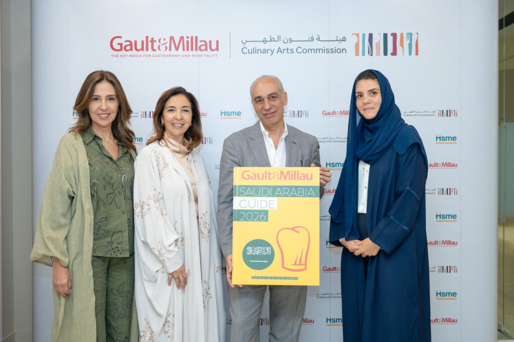 Dignitaries with a giant version of the yellow guide