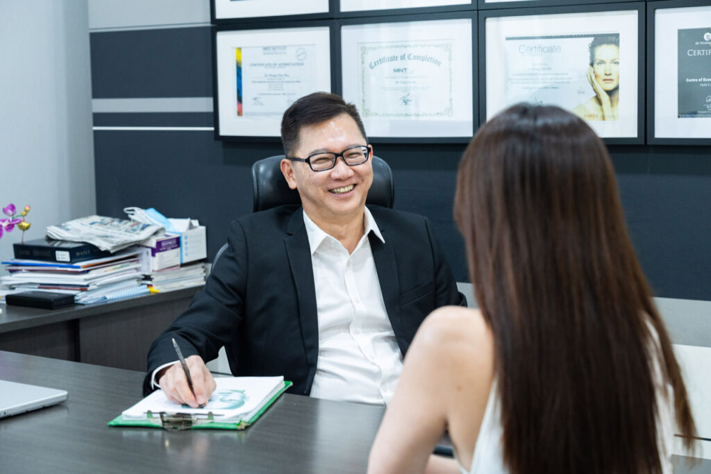 Dr Wong conducting a consultation