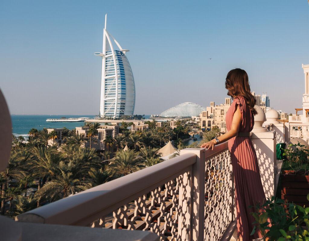 A Majestic Journey Awaits: Balloons at the Palace Returns with Arabian Skies 8 A female guest enjoying the view from the hotel terrace