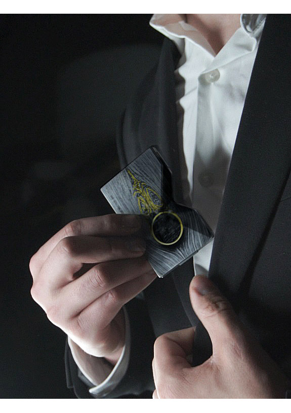 The wallet made from a meteorite being taken out of a pocket