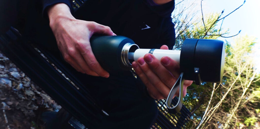 The bottle being opened showing the advanced filtration filter