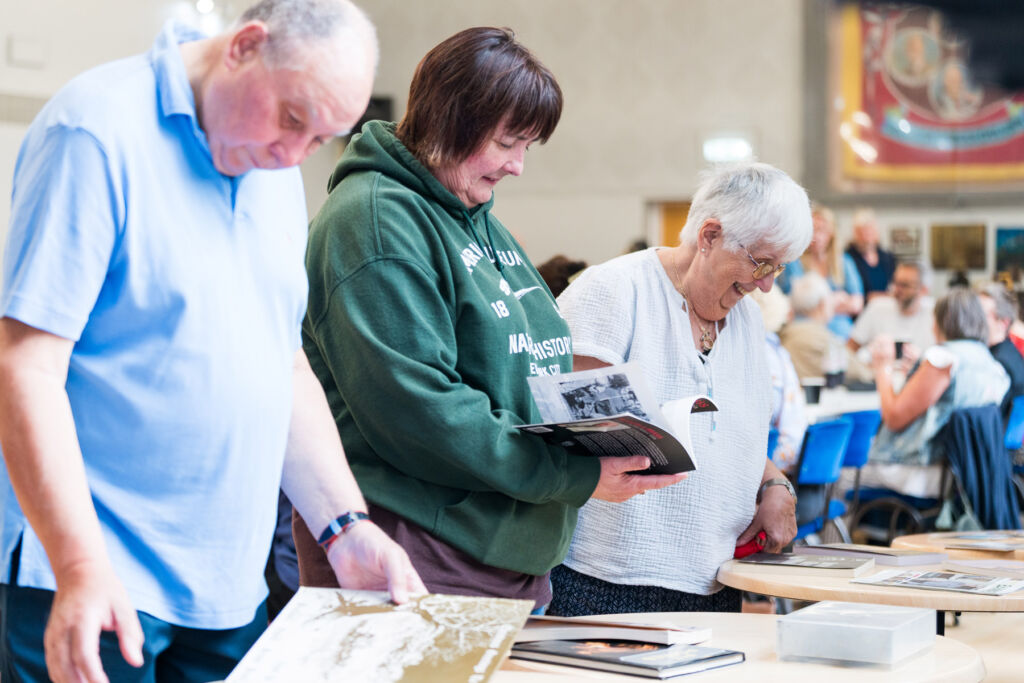 Family members browsing through the information on display at the listening party