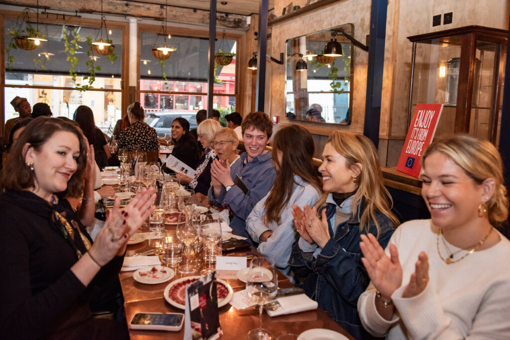 Omar Allibhoy Brings the Soul of Ibérico Ham to British Tables 12 A table full of people eager to sample the ham
