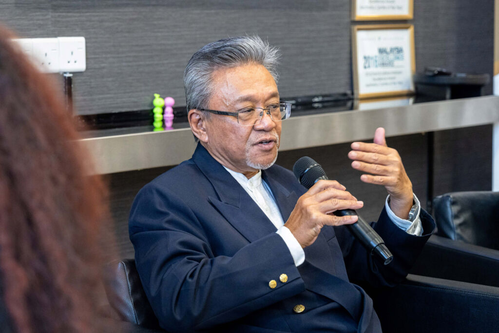 Dr Nasir answering questions at the panel discussion