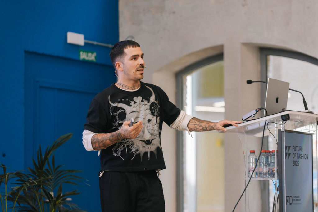 The Future of Fashion 2025: A New Era of Sustainability and Innovation 15 Horacio taking to the audience from the podium