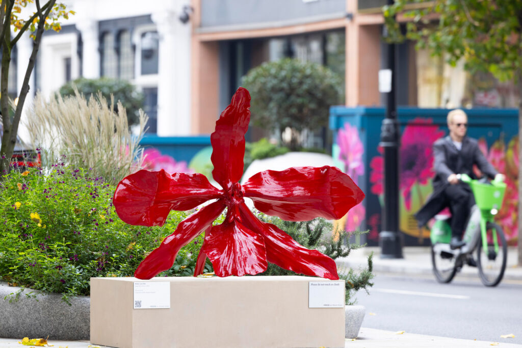 Frieze Week Brings Art and Green Elegance to London's Sloane Street 6 A bright red flower sculpture made from metals
