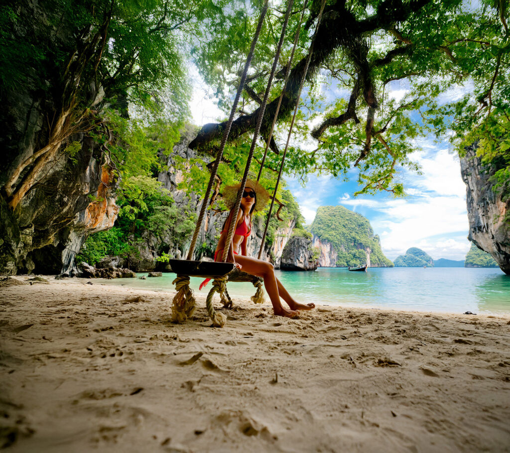 Virgin Atlantic Opens Nonstop Flight Between London Heathrow and Phuket 9 A female tourist sitting on a swing on the beach