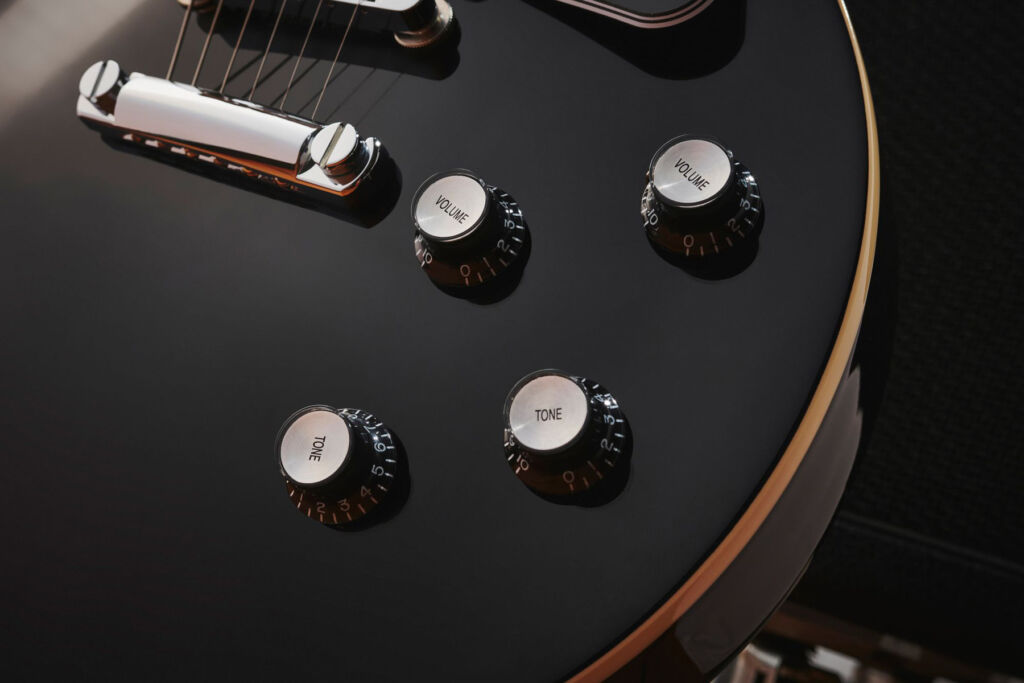 A closeup of the dials on the guitar