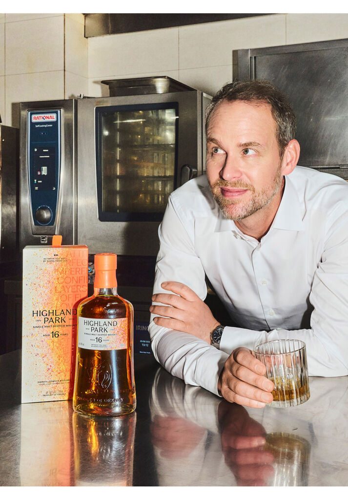 The decorated Chef relaxing next to one of the bottles