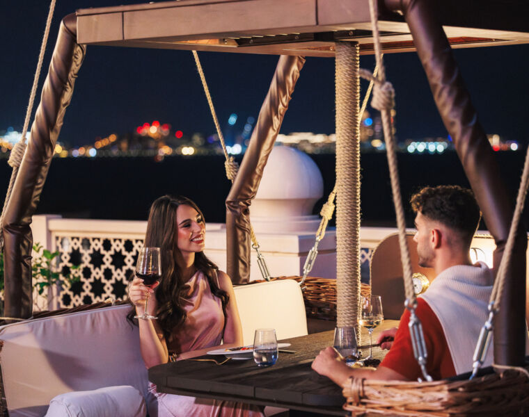 A couple relaxing in a balloon in the evening