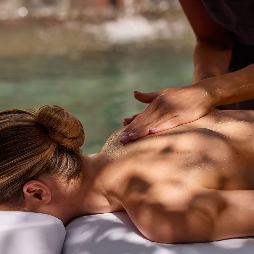 A female guest enjoying a massage outdoors