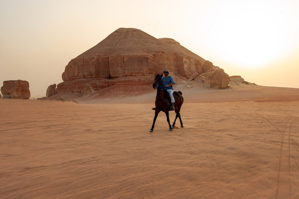 Saudi Arabia's UNESCO Treasures: Discover Eight Timeless Wonders 16 A man riding a horse in the desert at Al-Ahsa