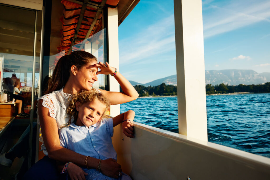 A mother and daughter admiring the views from a boat