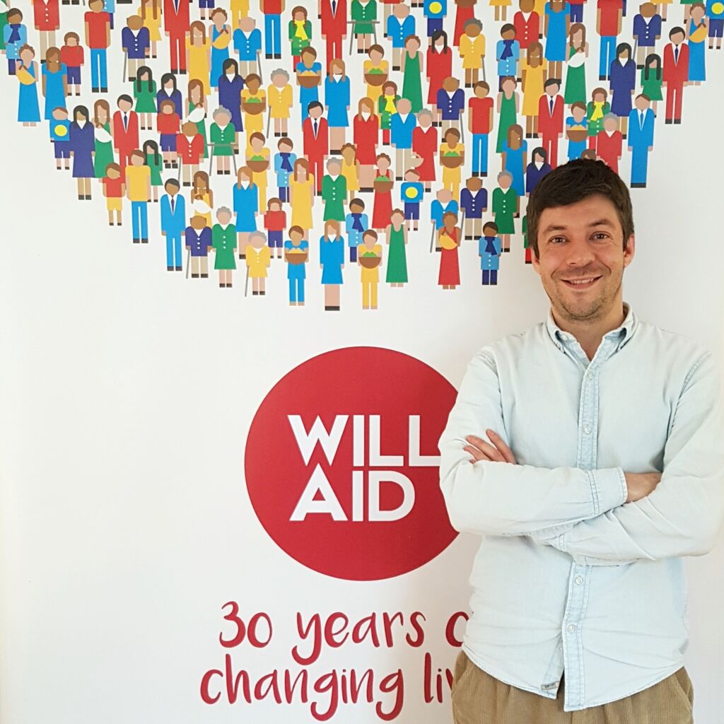 Will Aid 2025: Helping You Plan Ahead with Peace of Mind 6 Peter de Vena Franks standing in front of the Will Aid logo
