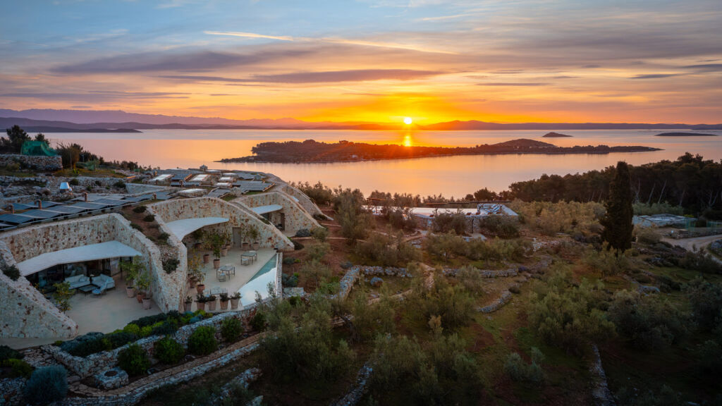 The villa at sunset with sea in the background