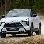 One of the company's cars driving on a rugged road