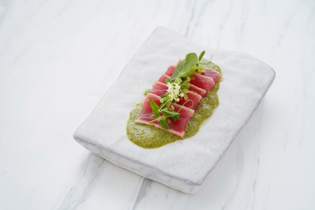 A New Chapter for Amilla Maldives’ Kitchens with Chef Sean Derrick Walles 8 A sliced ham dish with a parsley sauce