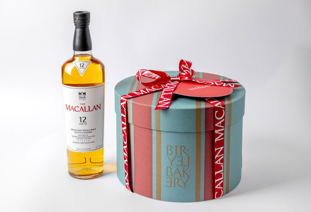 A bottle of The Macallan next to the Panettone box