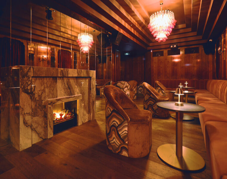 Christabel’s to Enhance Soho's Nightlife with New Private Members Club 1 A rendering showing a lit fireplace in the lounge