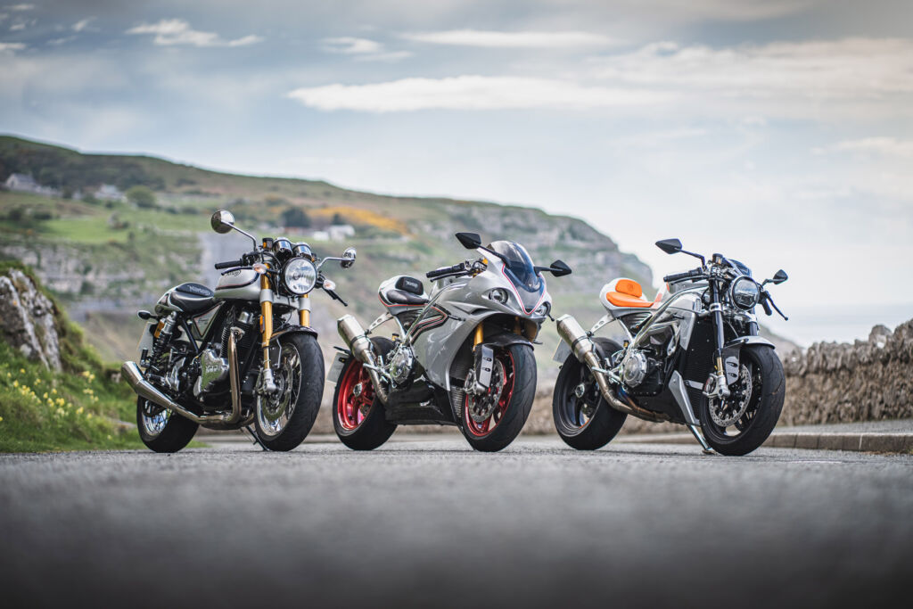 Three iconic Norton models standing side-by-side