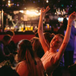 An excited young woman enjoying the happy atmosphere
