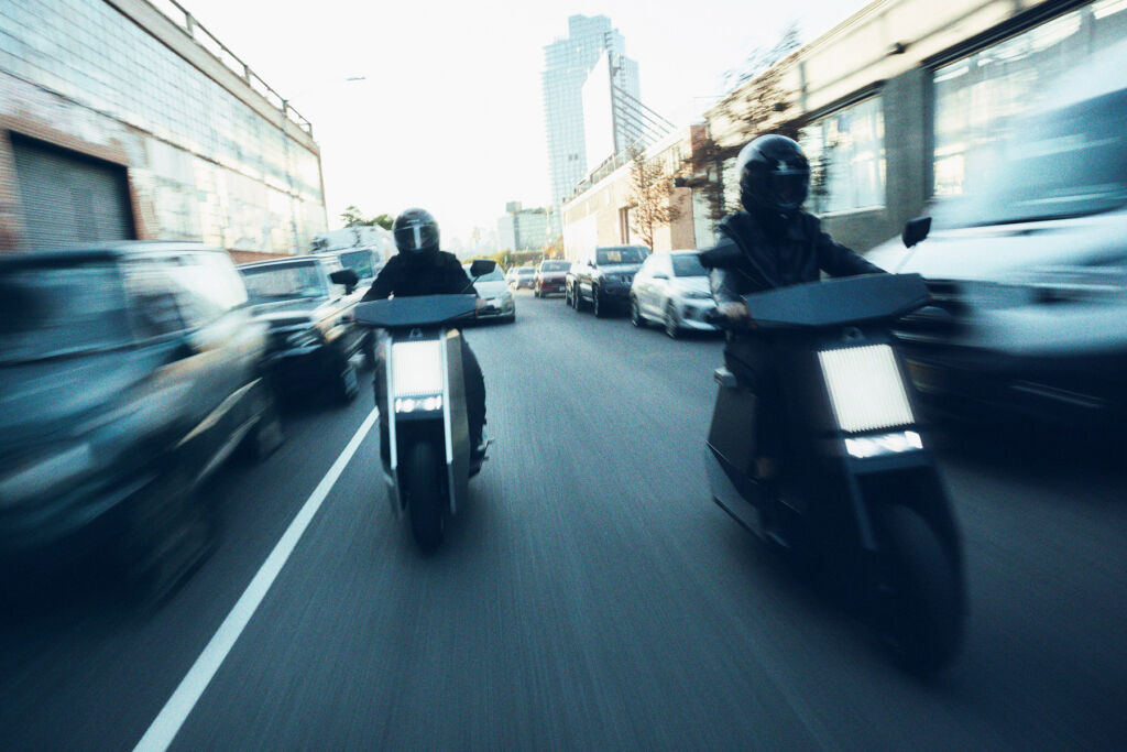 Two Infinite P1s being ridden on the streets